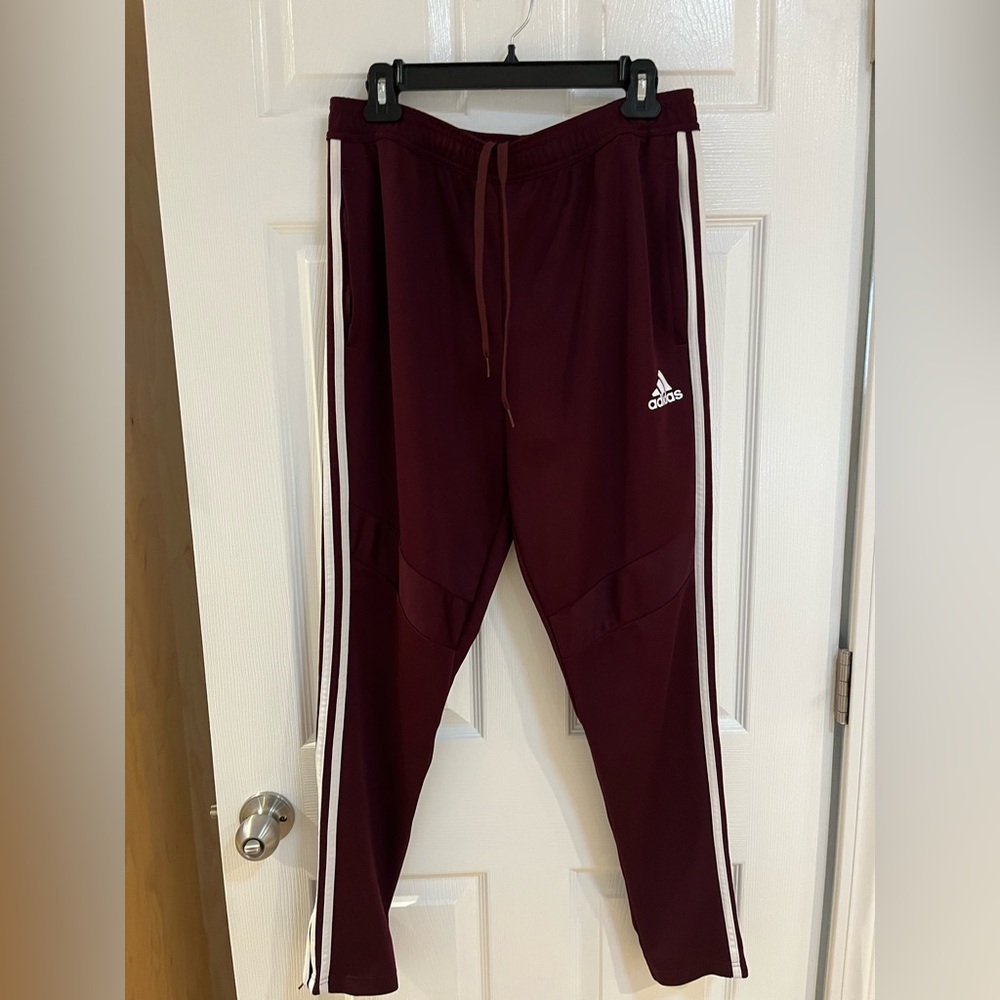 Men’s large Adidas Pants.  Like new condition. Maroon with white stripes